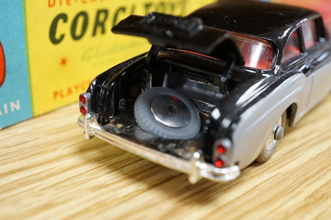 Two boxed Corgi Toys cars; a Bentley Continental Sports Saloon (224) in black and silver livery, with spare wheel, together with a Chevrolet Impala (220) in salmon pink. Condition - good, minor wear and rubbing to boxes.